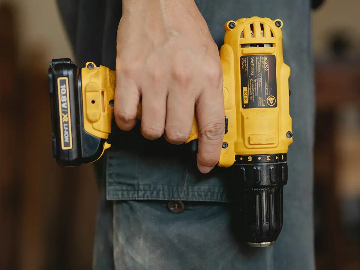 man holding electric drill